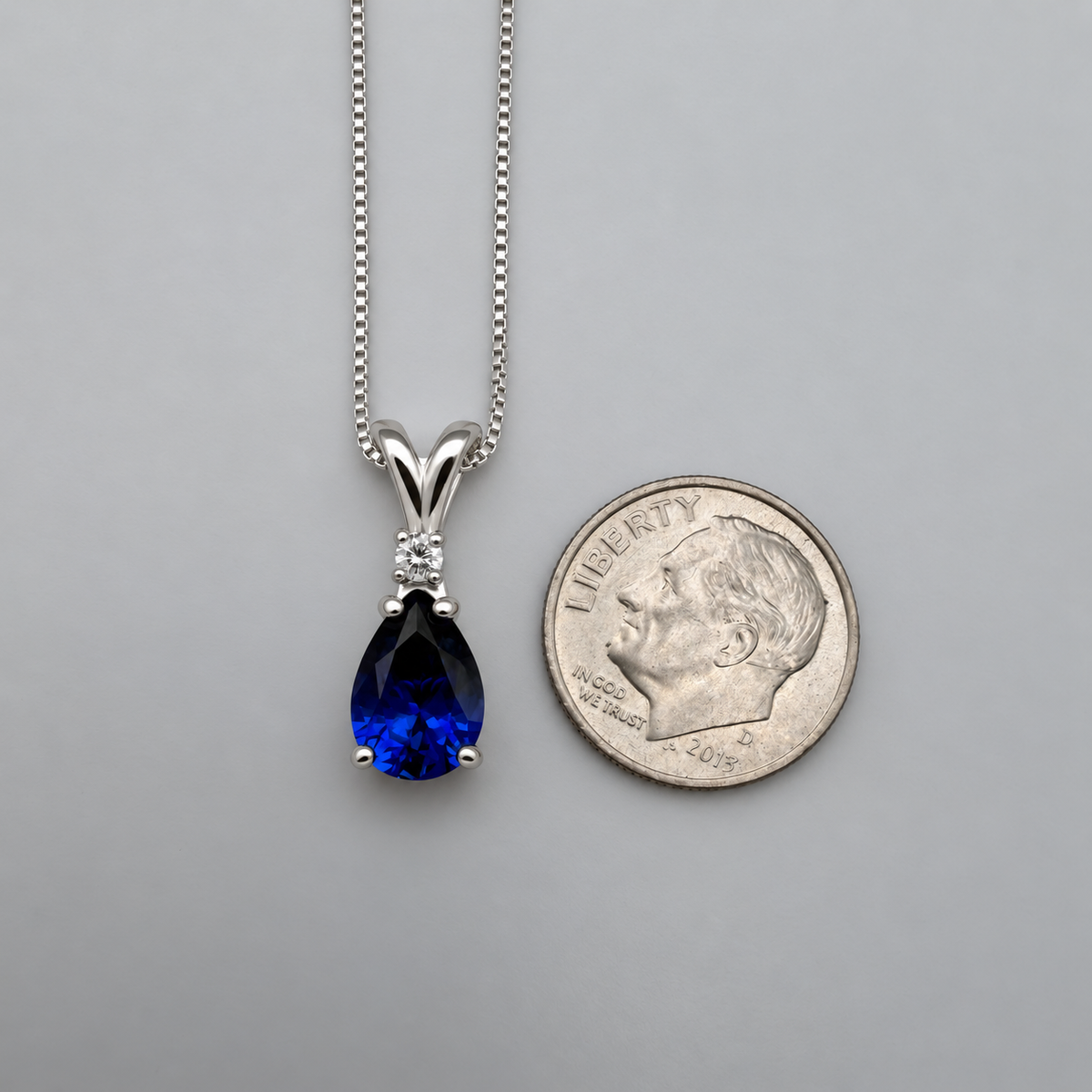 2.5ct Pear Cut Sapphire Necklace, White Sapphire Accent in Sterling Silver