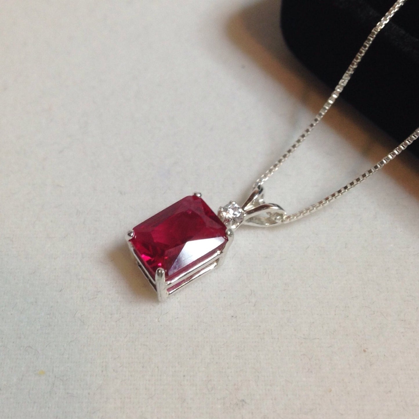 Beautiful Emerald Cut Ruby Necklace with White Sapphire accent